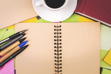 Modern desk with empty notepad