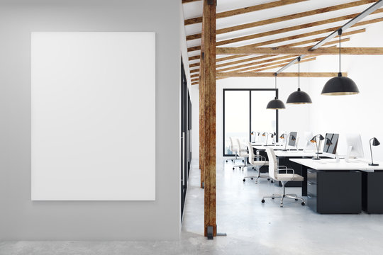 Coworking office with blank poster