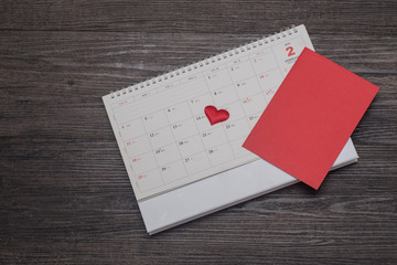 Valentines day background, card and gift on the calendar