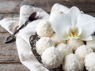Coconut candy Plate Vintage Orchid Flower Wooden Background Copy space