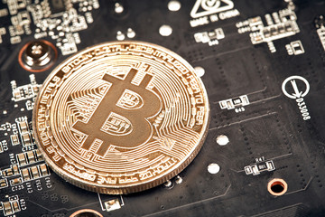 Bitcoin. New virtual money. Bitcoins lie on the video card, concept of mining.