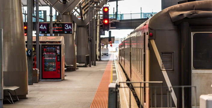 A passenger train waits at platform 3A at Southern Cross Station in Melbourne Australia