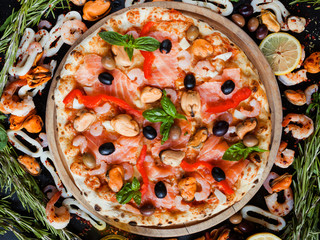 Mediterranean pizza with seafood and olives. Classical homemade recipe concept