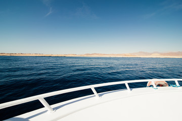 Wide angle shot of front of the deck yacht in summer time