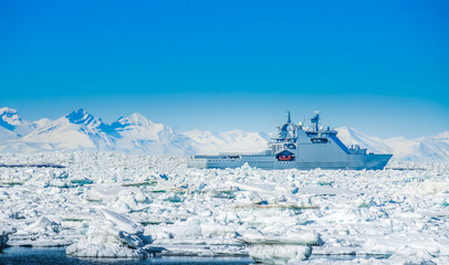 Icebreaker ship surrounded by icebergs, Spitsbergen, Svalbard, Norway