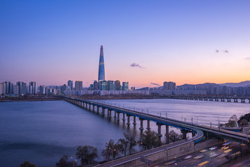 Han River at twilight with view of Seoul city skyline in South Korea