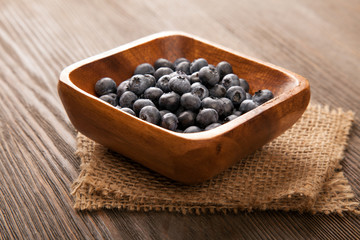ripe sweet blueberries on wooden table