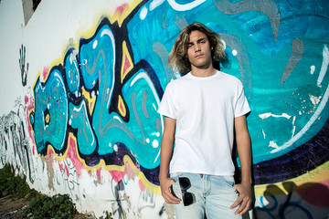 Young man near the blue wall