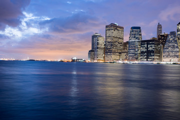 Fototapeta na wymiar Manhattan's Financial district skyline at night from the Brooklyn Bridge Park, New York City