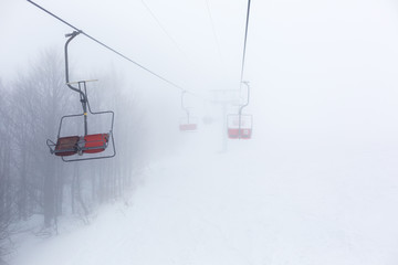 Ski-lift in fog