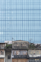 Abandoned residential building and modern office building in Hong Kong