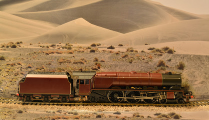 A Coronation class locomotive set on a scenic Landscape