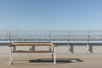 empty seat on deck with blue sky background