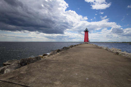 Summer Lighthouse Background. Manistique Michigan Lighthouse under a beautiful blue summer sky. Upper Peninsula, Michigan, USA.