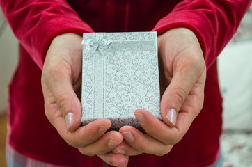 Woman Is Holding White Gift Box With Ribbon