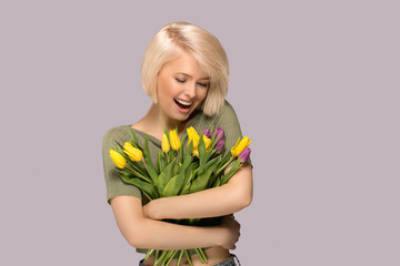 Woman holding a bouquet of tulips