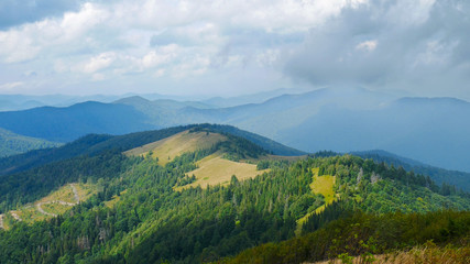 Fototapeta na wymiar View on Carpathians mountains valley in cloudy summer day