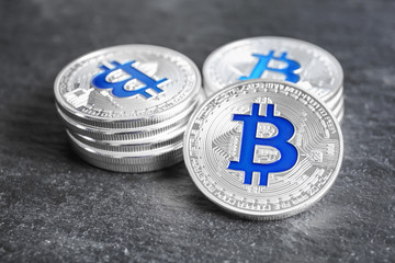 Silver bitcoins on dark background