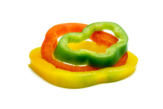 Sliced sweet pepper or bell pepper or Capcicum with three colour (green, red and yellow) on white background food ingredients concept