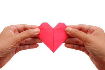 Hand holding red heart paper origami on white background for Valentine's day and love concept