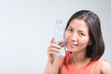 Beautiful Asian women and Bottled water