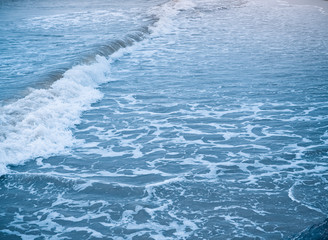 Beautiful wave of the sea on the sand beach. Used for landscape background.