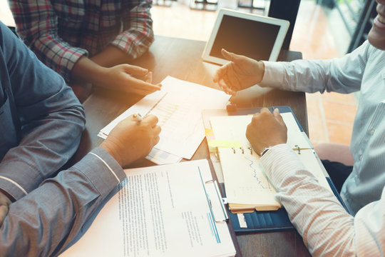 Team businessmen are discussing or negotiating business channels.