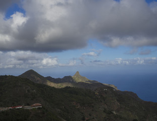 view on Monte Taborno with green hills and dramatic blue sky white clouds famous mountain in anaga tenerife canary island spain