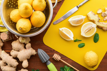 lemon and ginger with mint and honey. on a wooden background in a rustic style.