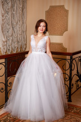 Fototapeta premium Young beautiful fashion bride posing in studio