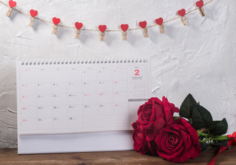 Valentines day background, card and gift on the calendar