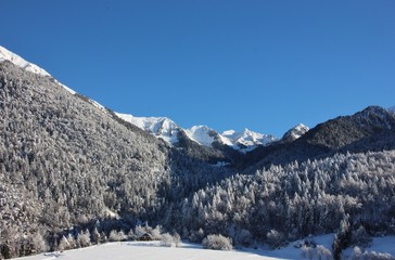 Fototapeta na wymiar Alpine village of Bondo, Sella Giudicarie (TN), Trentino Alto Adige. Italy. Snowy landscape