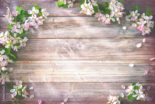 Spring blooming branches on wooden background