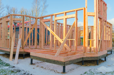 construction of wooden frame houses, on pile foundations