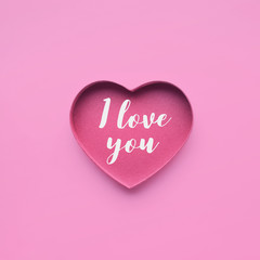 I love you on heart shape paper in pink color.love, valentine,wedding concepts