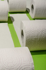 Toilet paper concept on green background. Hygiene and health. Concept photo.