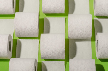 Toilet paper concept on green background. Hygiene and health. Concept photo.
