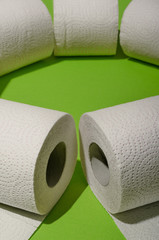 Toilet paper concept on green background. Hygiene and health. Concept photo.