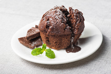 Sweet muffin cake with melted chocolate
