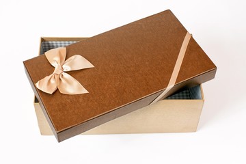 Open brown gift box with ribbon bow, isolated on white