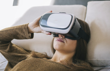 Young girl wearing virtual reality glass