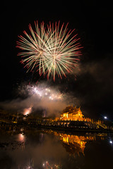 Fototapeta premium Fireworks celebrate the New Year 2018 at Rajapruek Royal Park, Chiang Mai with beutiful light of Hor Khum Luang temple,Thai Tradition Building