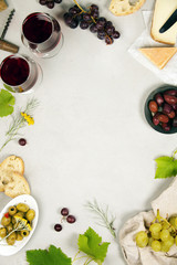 Wine and snack set. Grey marble background, top view, copy space