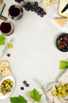 Wine and snack set. Grey marble background, top view, copy space