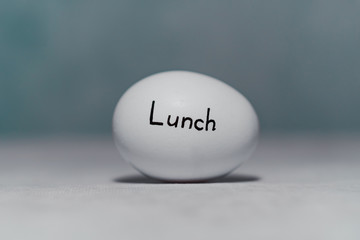 An inscription on a chicken egg for a reminder of the diet. Lunch.
