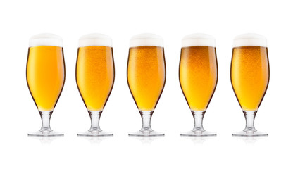 Cold glasses of lager beer with foam and dew