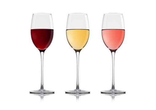Glasses of white red and pink rose wine on white