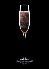 Rose pink champagne glass with bubbles on black