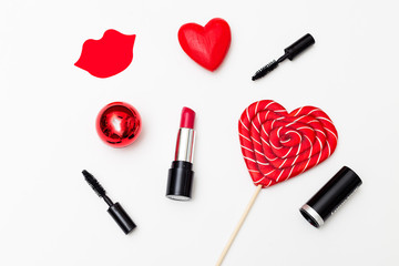 Obraz na płótnie Canvas Make-up with red lipstick for St. Valentine's Day. Flat lay