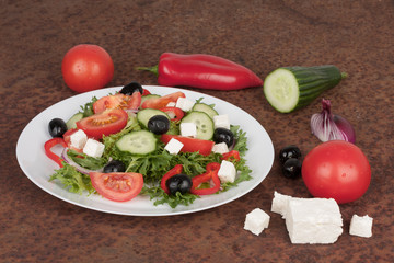 Traditional greek sallad on white plate